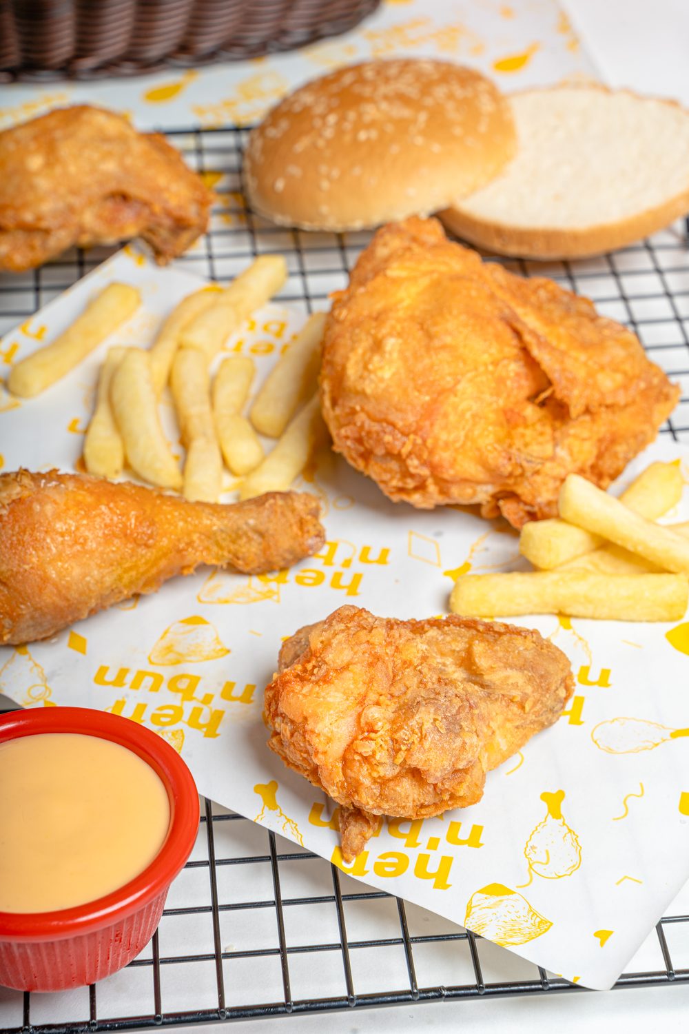 Broast legs with fries and a red dip bowl