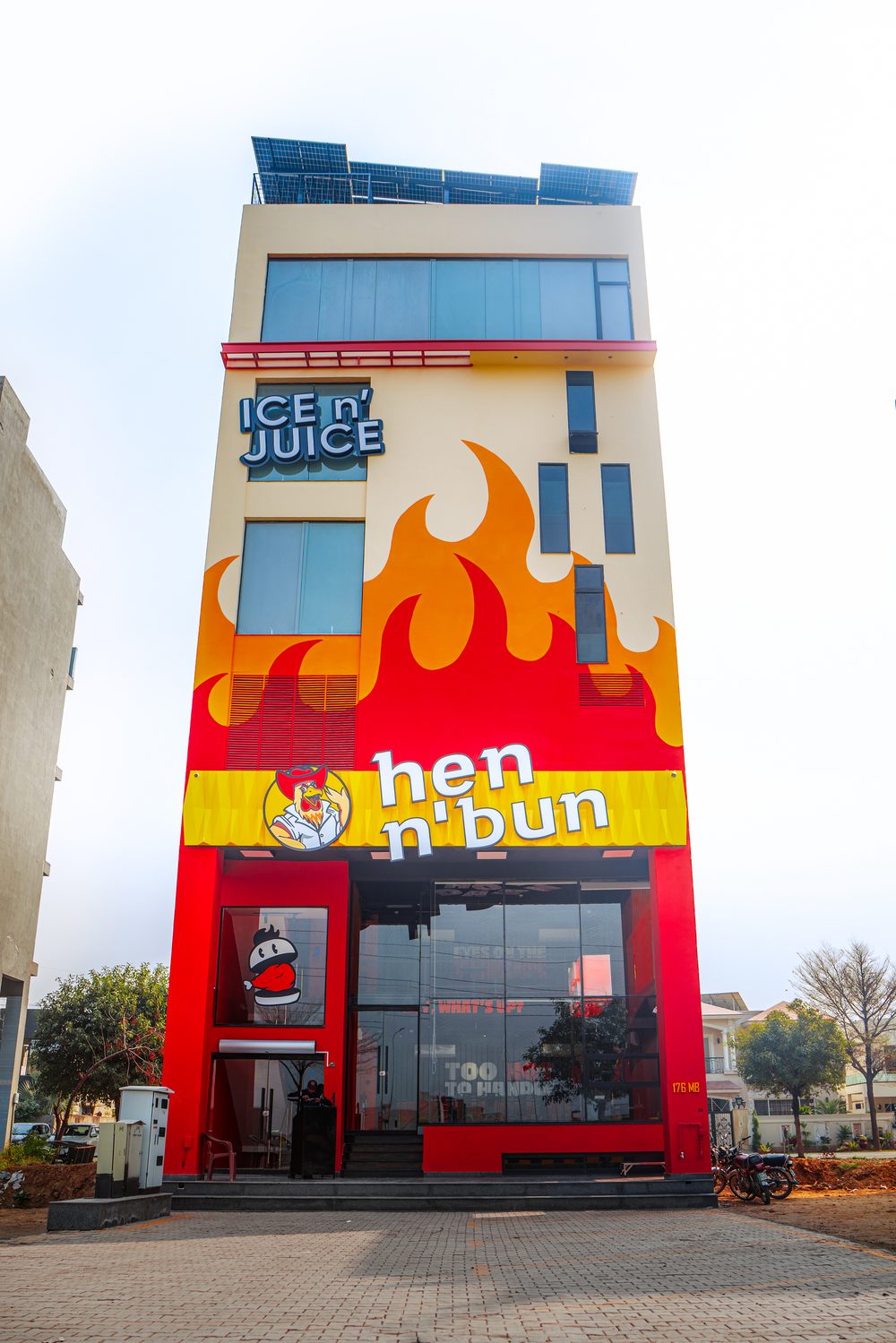 A hen n' bun branch storefront with flame artwork